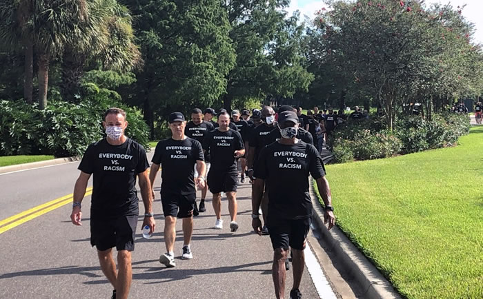 NBA referees march in support of players seeking an end to racial injustice in Lake Buena Vista, Fla., Thursday, Aug. 27, 2020. (AP Photo/Brian Mahoney).